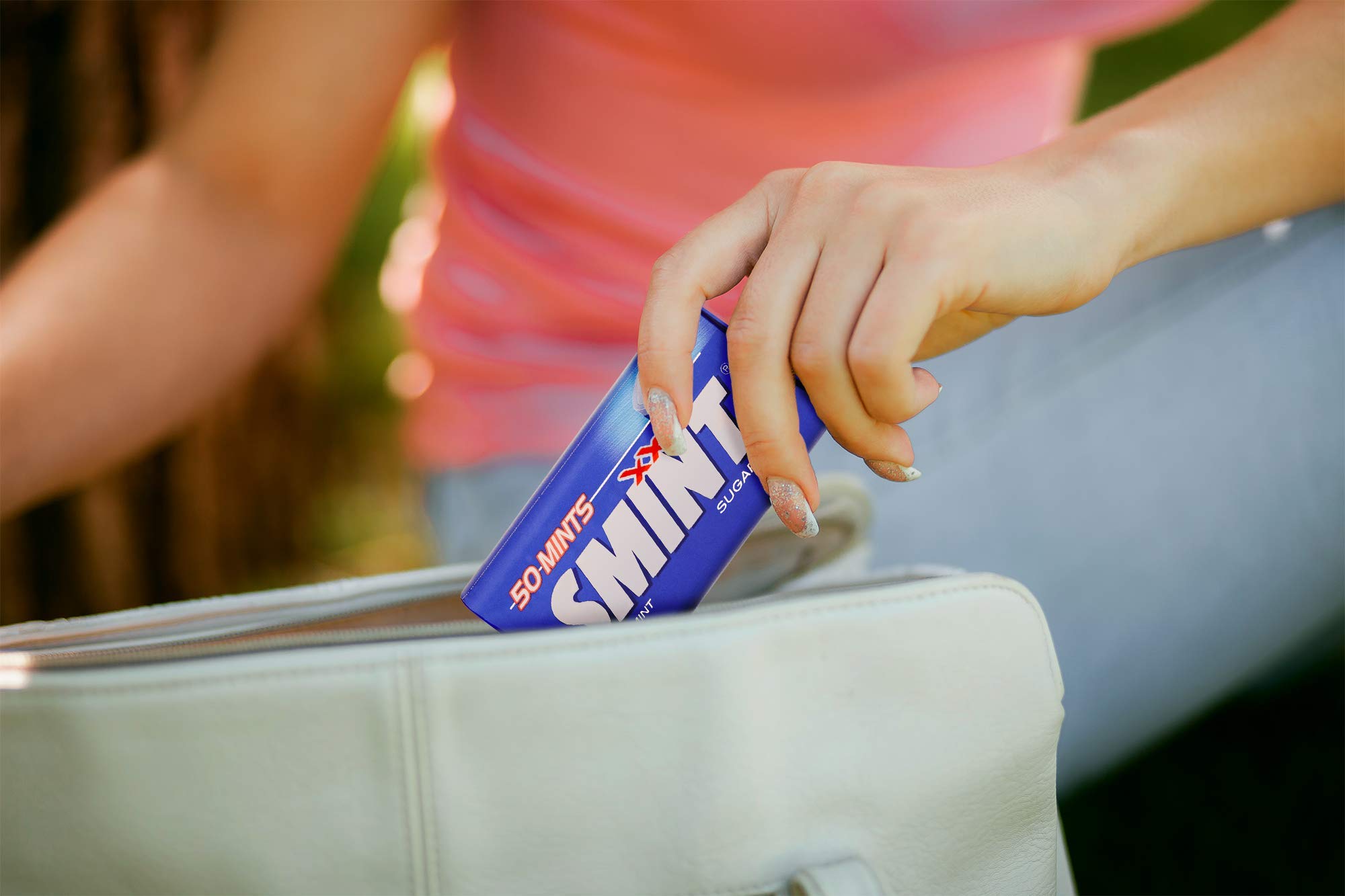 smint open tin revealing 50 mints and organized contents for convenience