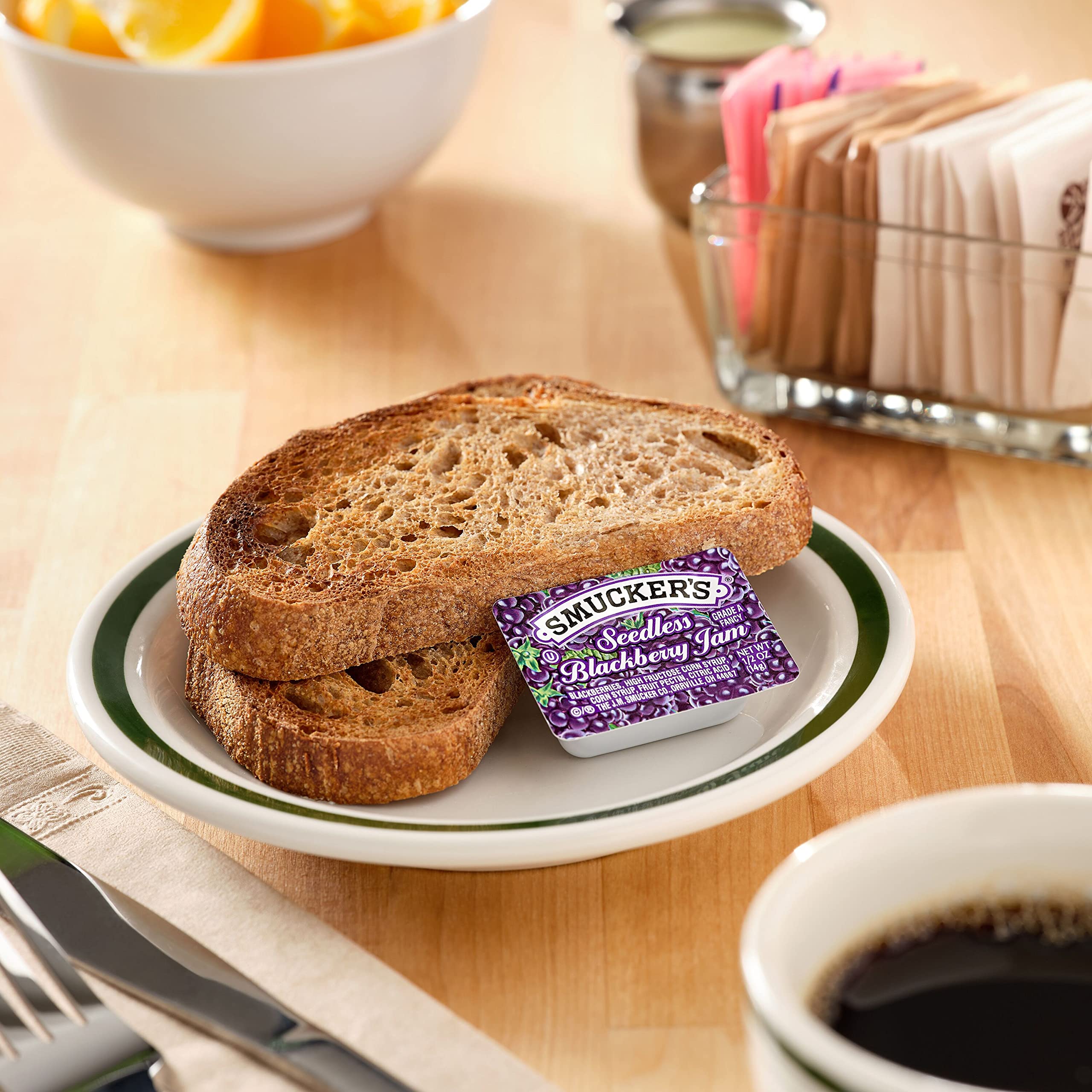 Smucker's close-up of smooth seedless blackberry jam texture for easy spreading