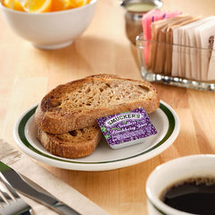 Smucker's close-up of smooth seedless blackberry jam texture for easy spreading