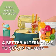 Snackathon honey straw being squeezed into a steaming cup of tea for quick sweetening