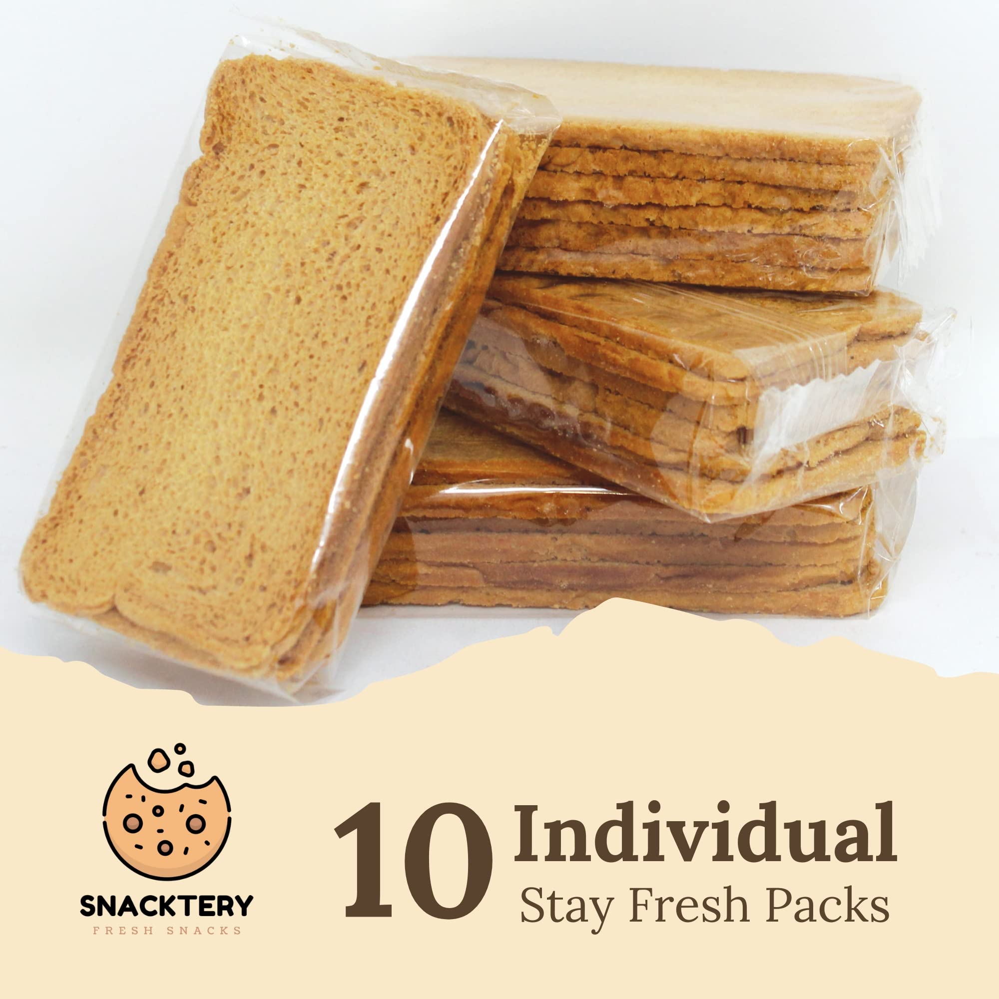SNACKTERY toast held in hand for scale, demonstrates slim ideal portion size