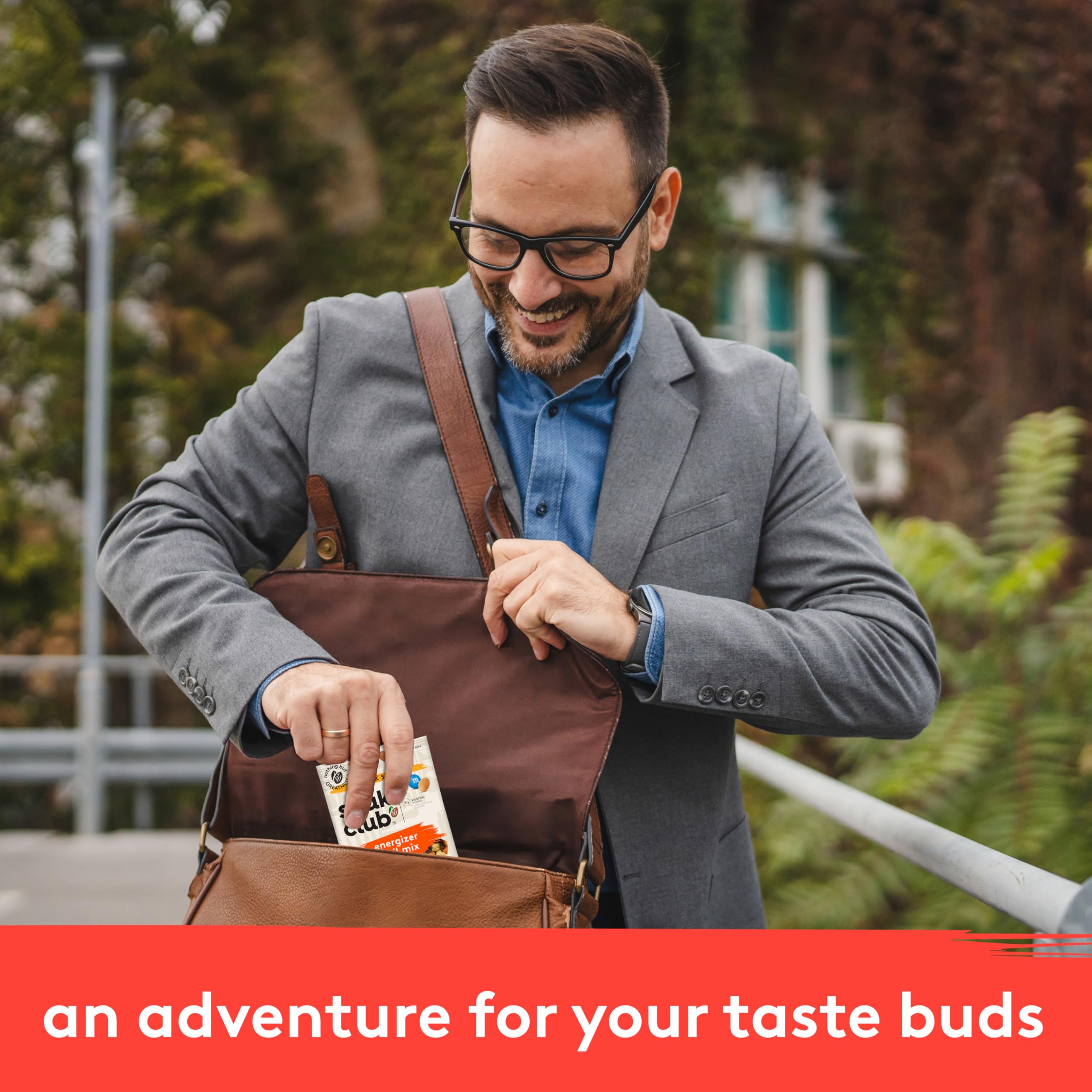 Snak Club pouches inside backpack demonstrating easy travel-ready snacking
