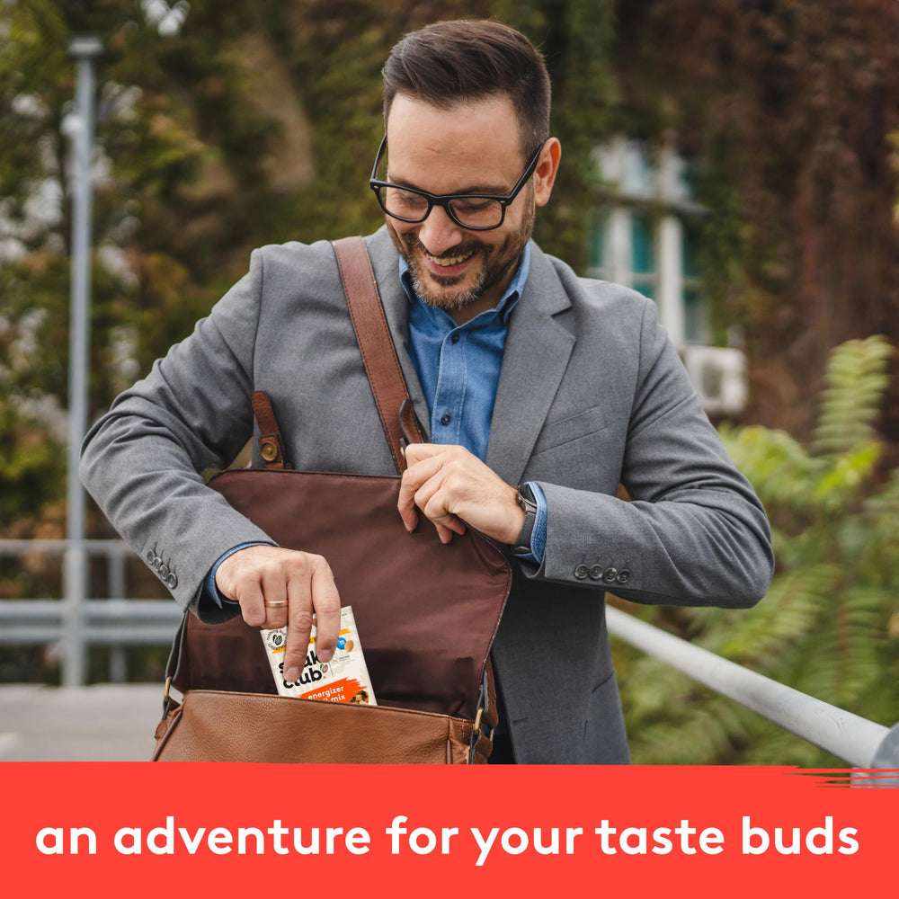 Snak Club pouches inside backpack demonstrating easy travel-ready snacking