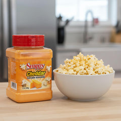 SNAPPY cheddar seasoning on popcorn bowl delivering theater-style taste