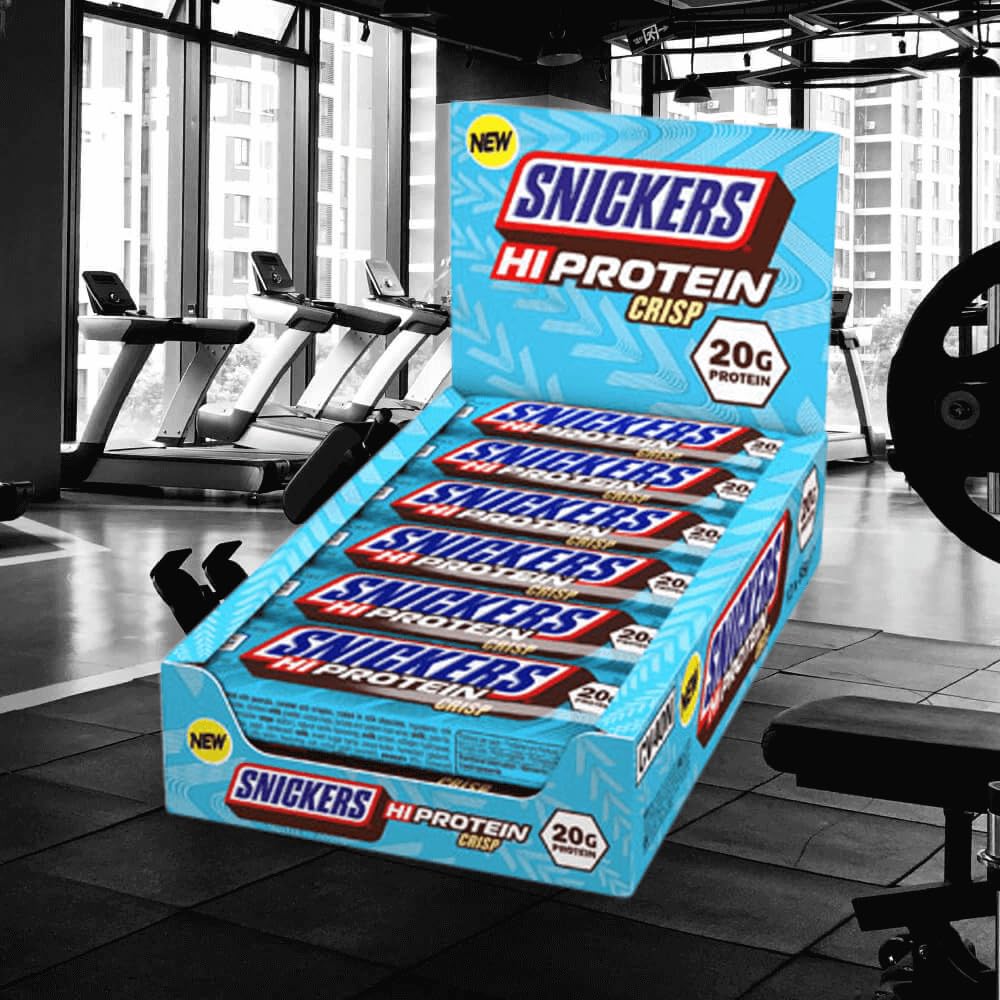 Snickers HiProtein Crisp broken bar close-up highlighting crisp texture and chocolate, appealing bite