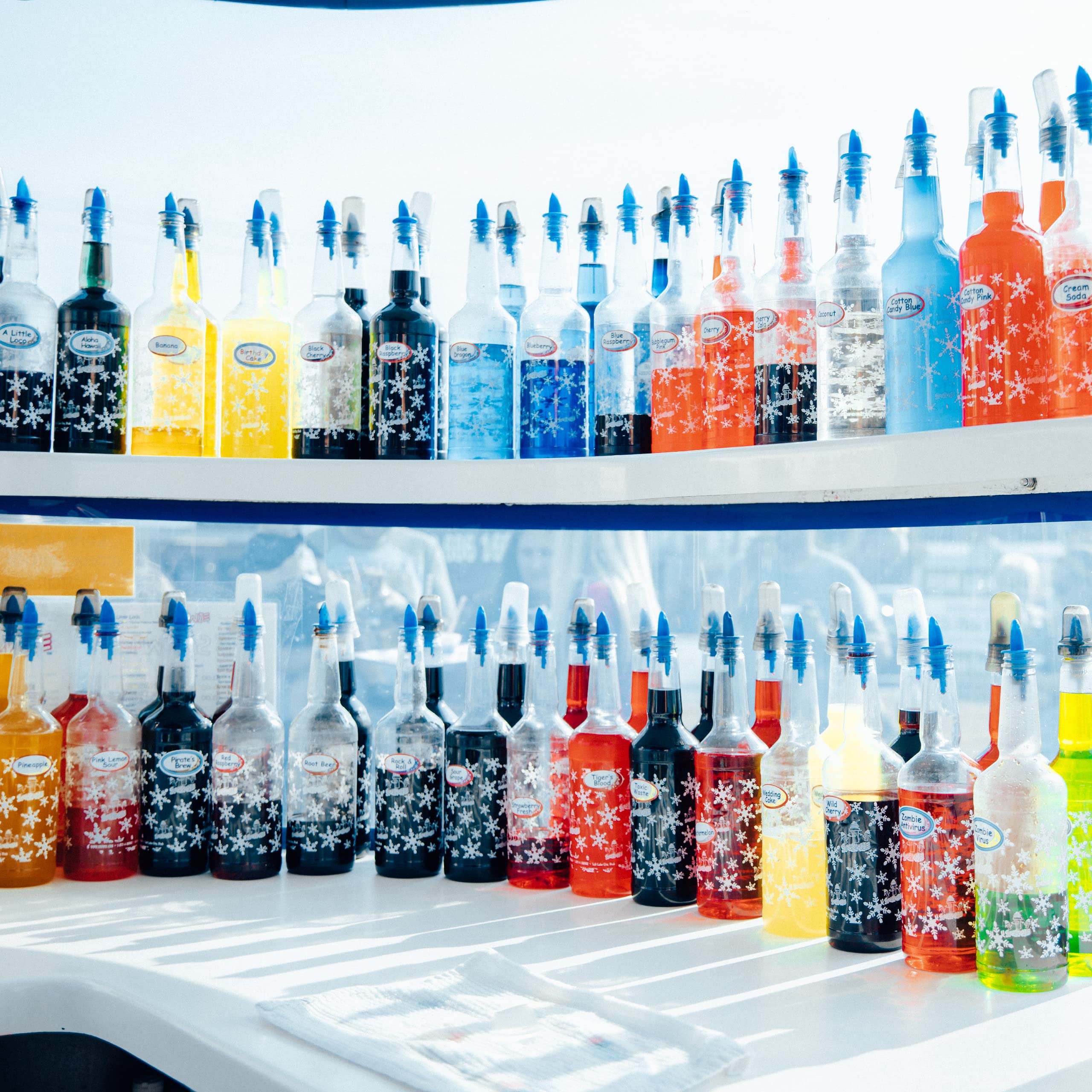 SNOWIE concentrate being poured into a serving bottle for quick mixing