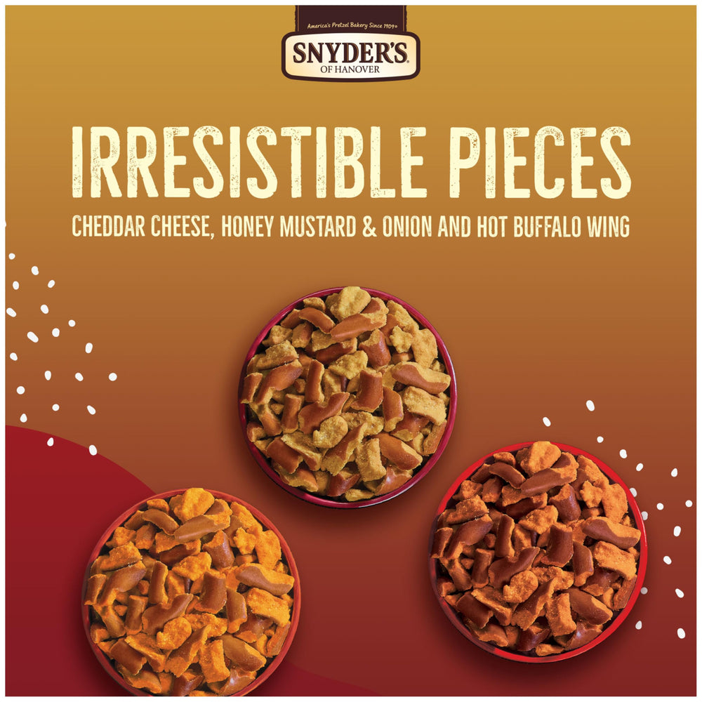 Snyder's of Hanover Cheddar Cheese bag detail showing cheesy coating for satisfying crunch