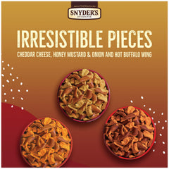 Snyder's of Hanover Cheddar Cheese bag detail showing cheesy coating for satisfying crunch