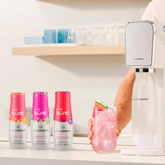 sodastream Bubly Burst being poured into a sparkling glass, demonstrating controlled mix and vibrant color