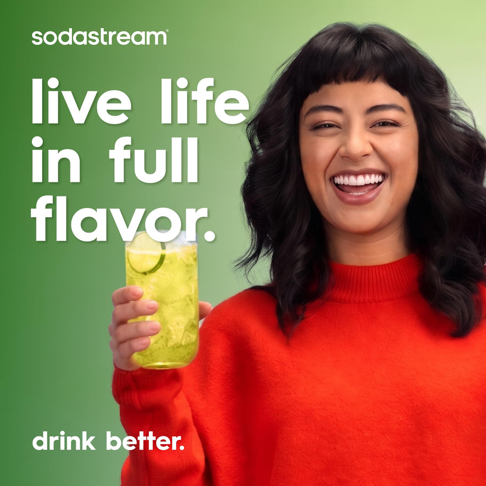 sodastream refillable cylinder and syrups with recycling bin showing sustainability benefit less waste