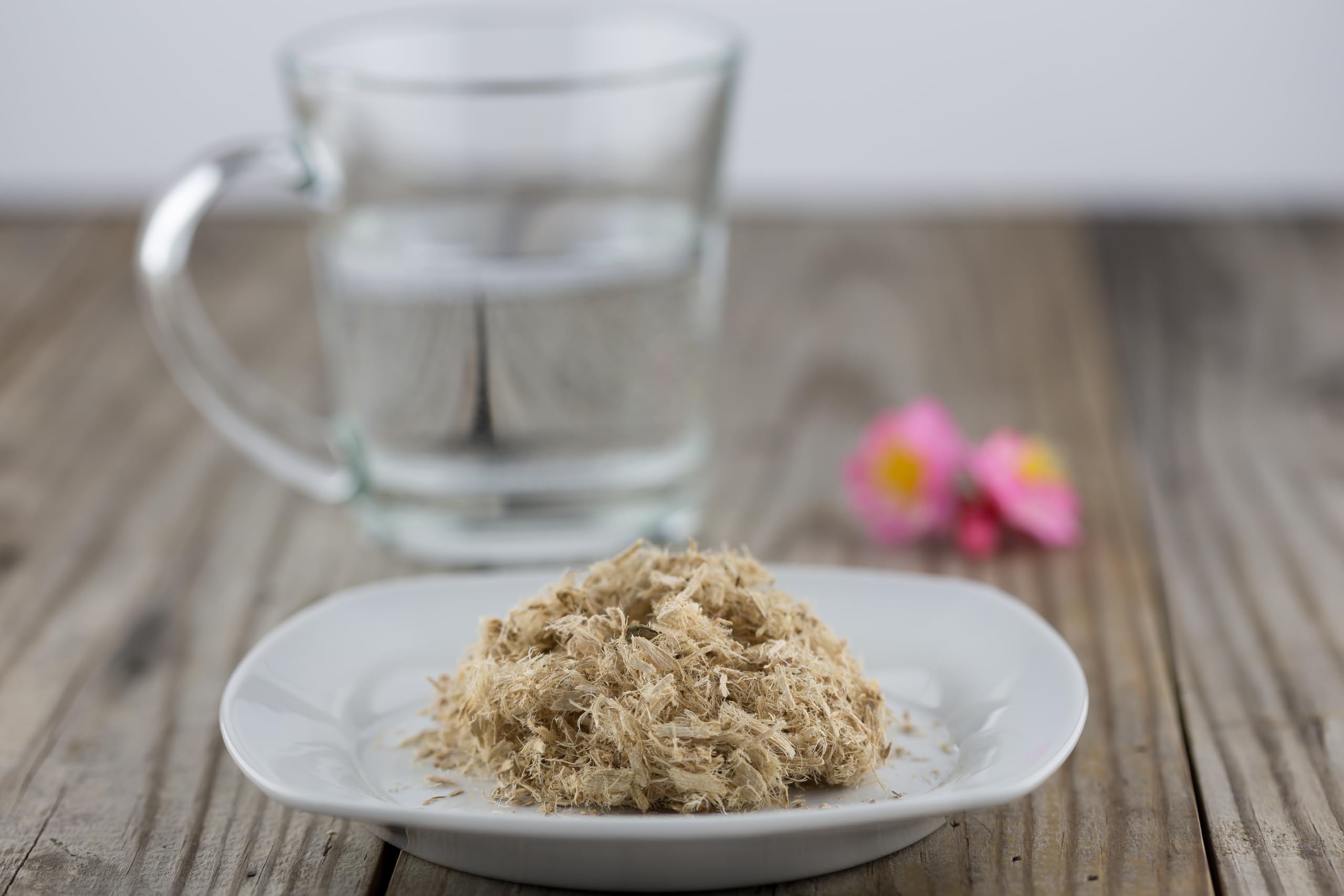 Solo Therapy brewed slippery elm tea in cup with spoon highlighting comforting sip