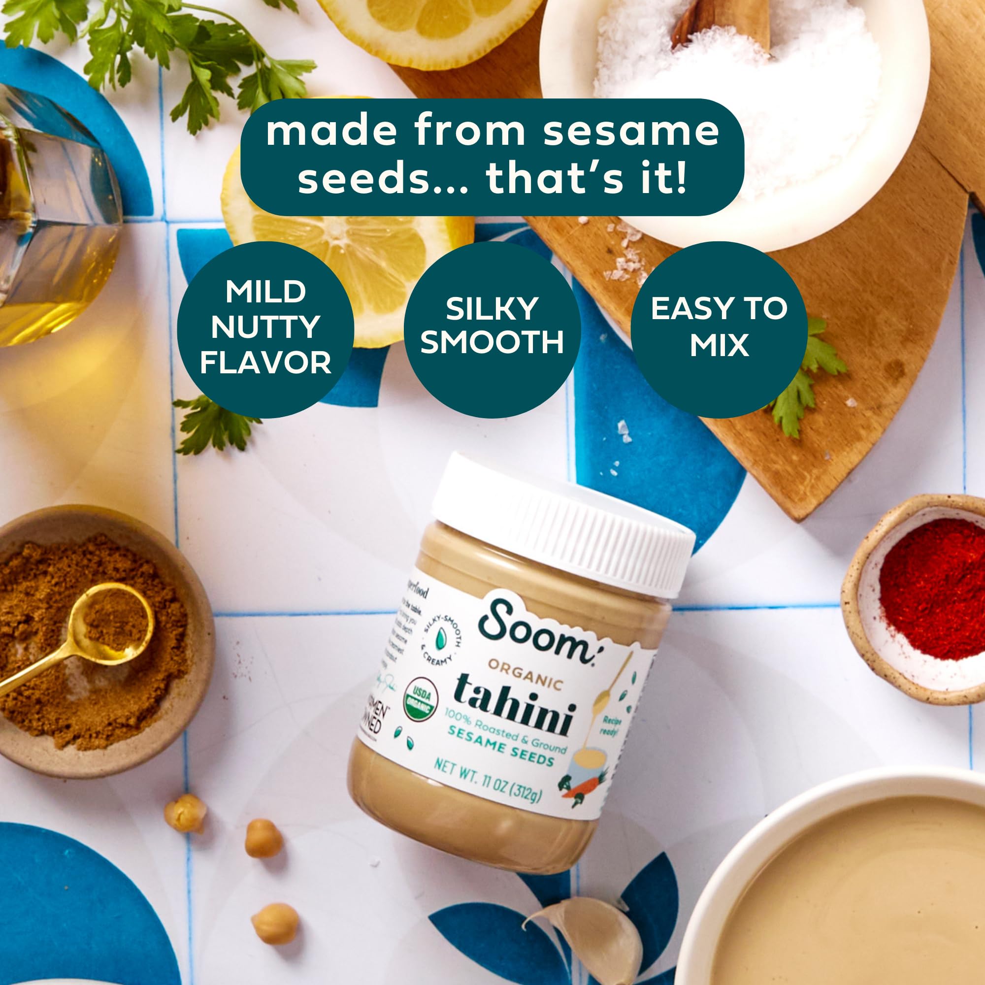 Soom jar open with creamy tahini pouring for smooth mixing benefits