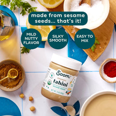 Soom jar open with creamy tahini pouring for smooth mixing benefits