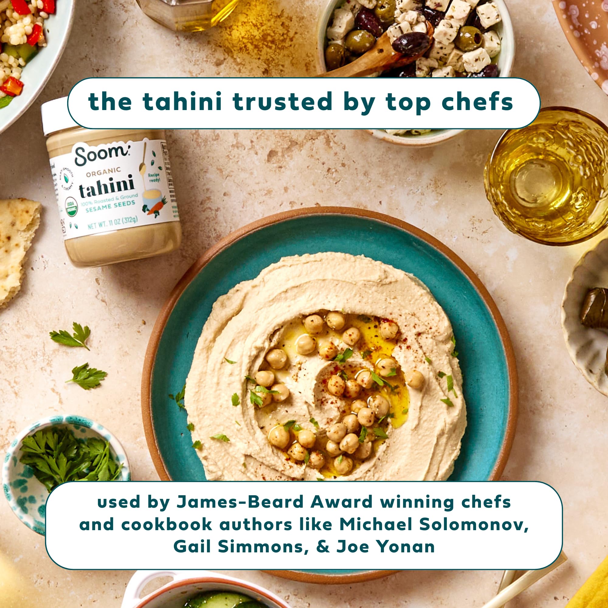 Soom tahini jar next to a bowl of hummus showing creamy finish and ease