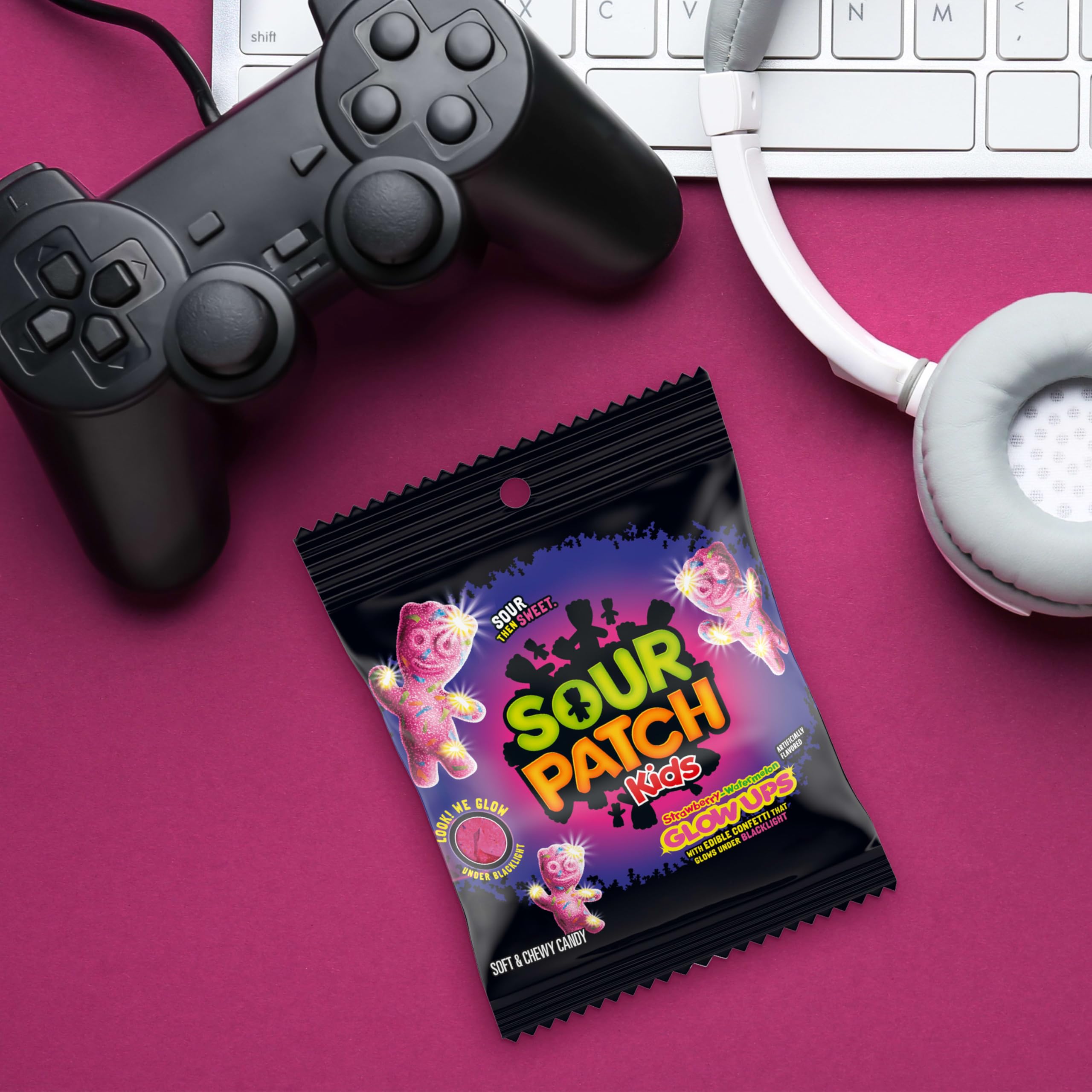 SOUR PATCH KIDS hand holding bag showing on-the-go snacking convenience