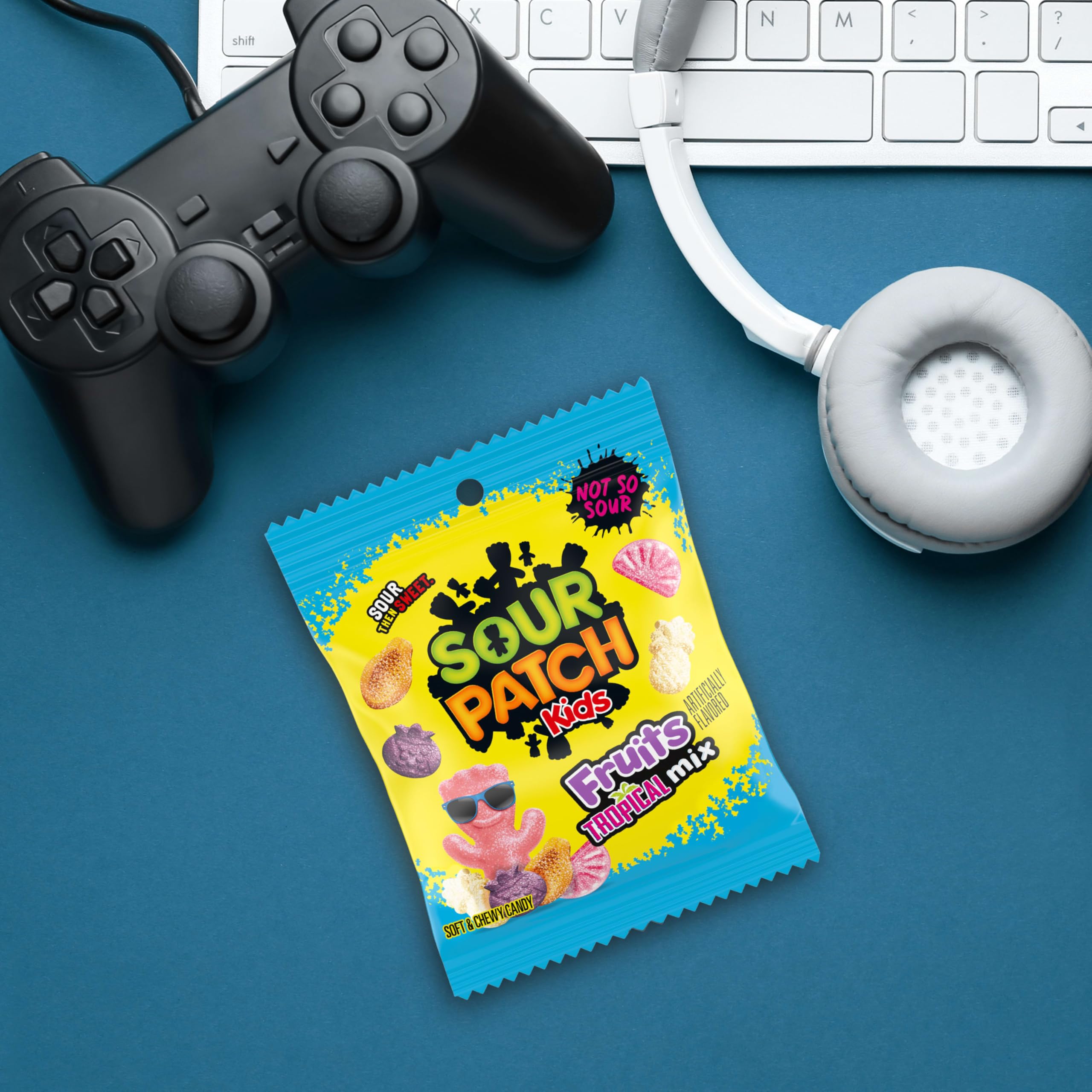 SOUR PATCH KIDS hand holding bag for size comparison and portion-friendly serving