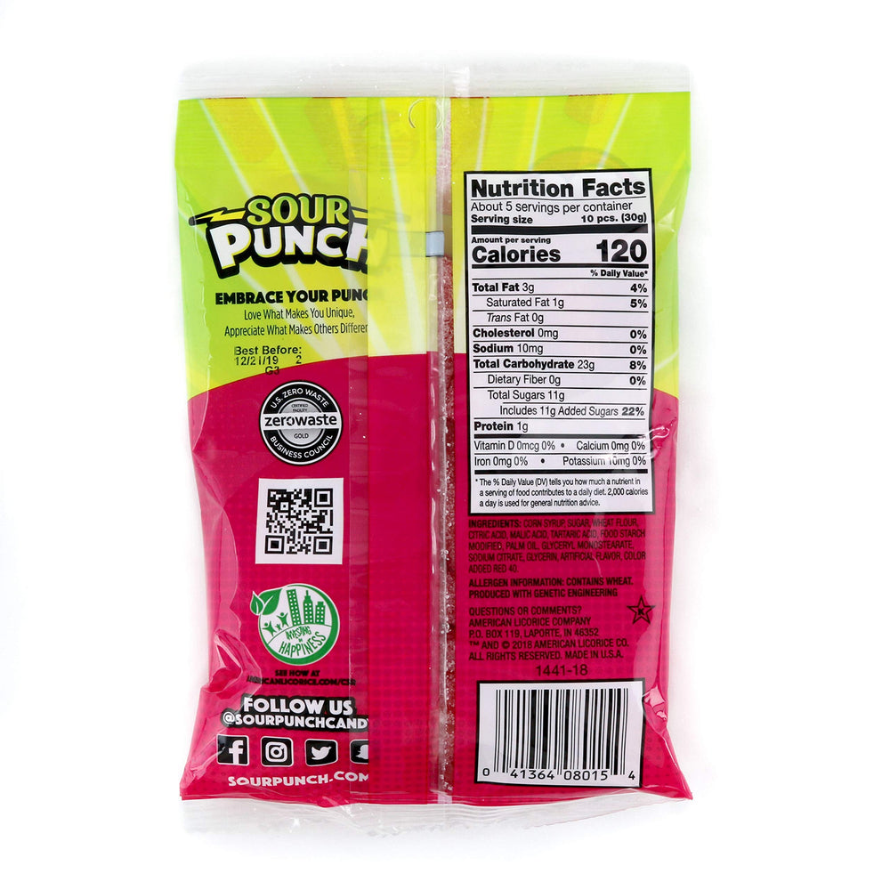 Sour Punch bites scattered on table showing vibrant strawberry flavor