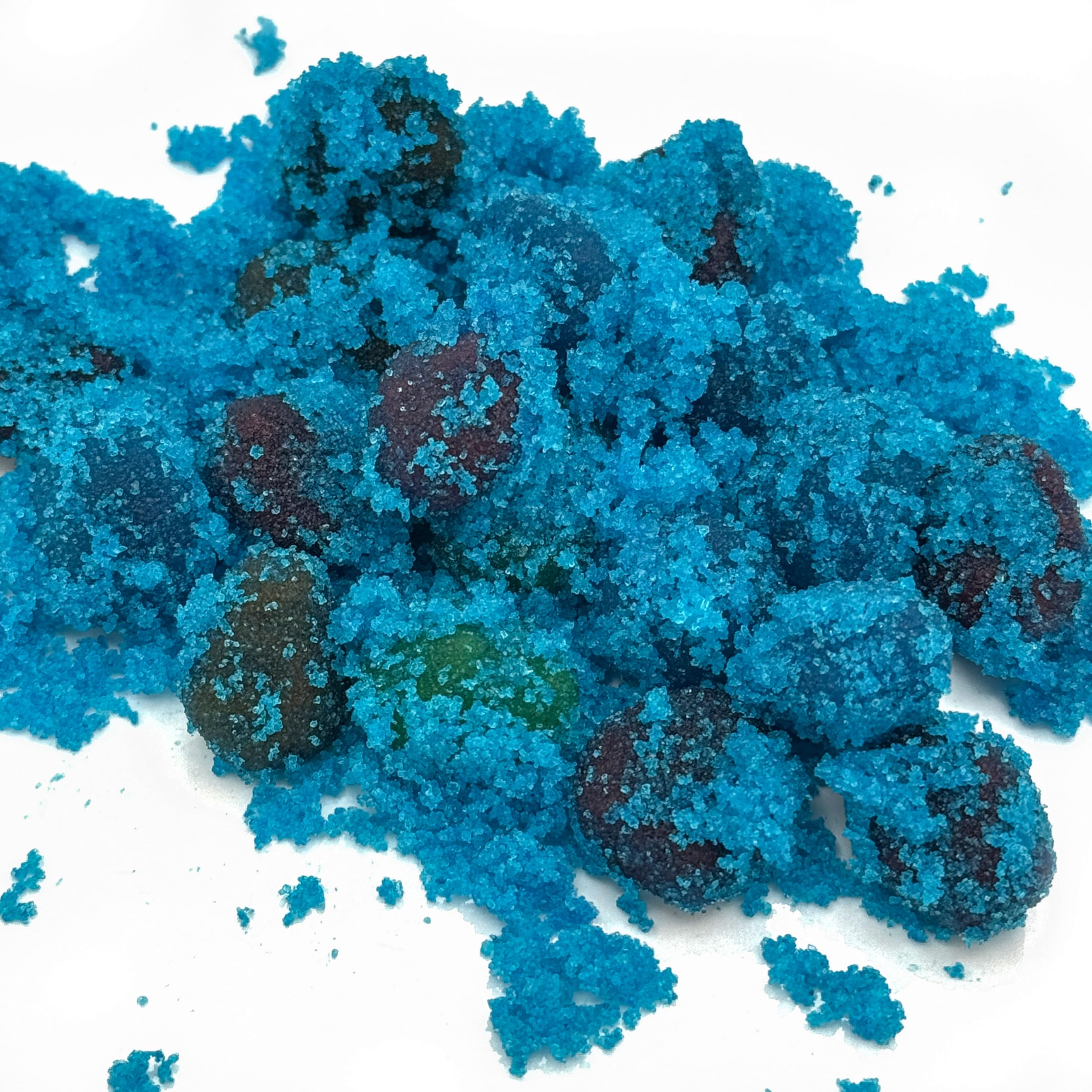 Split-open Sourboy Gusher revealing blue raspberry liquid center and juicy burst