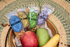 South Forty Snacks bar on a kitchen table with fruit, suggests satisfying snack pairing
