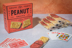 SOUTH FORTY SNACKS bar held in hand to show 40g portion size and portable convenience