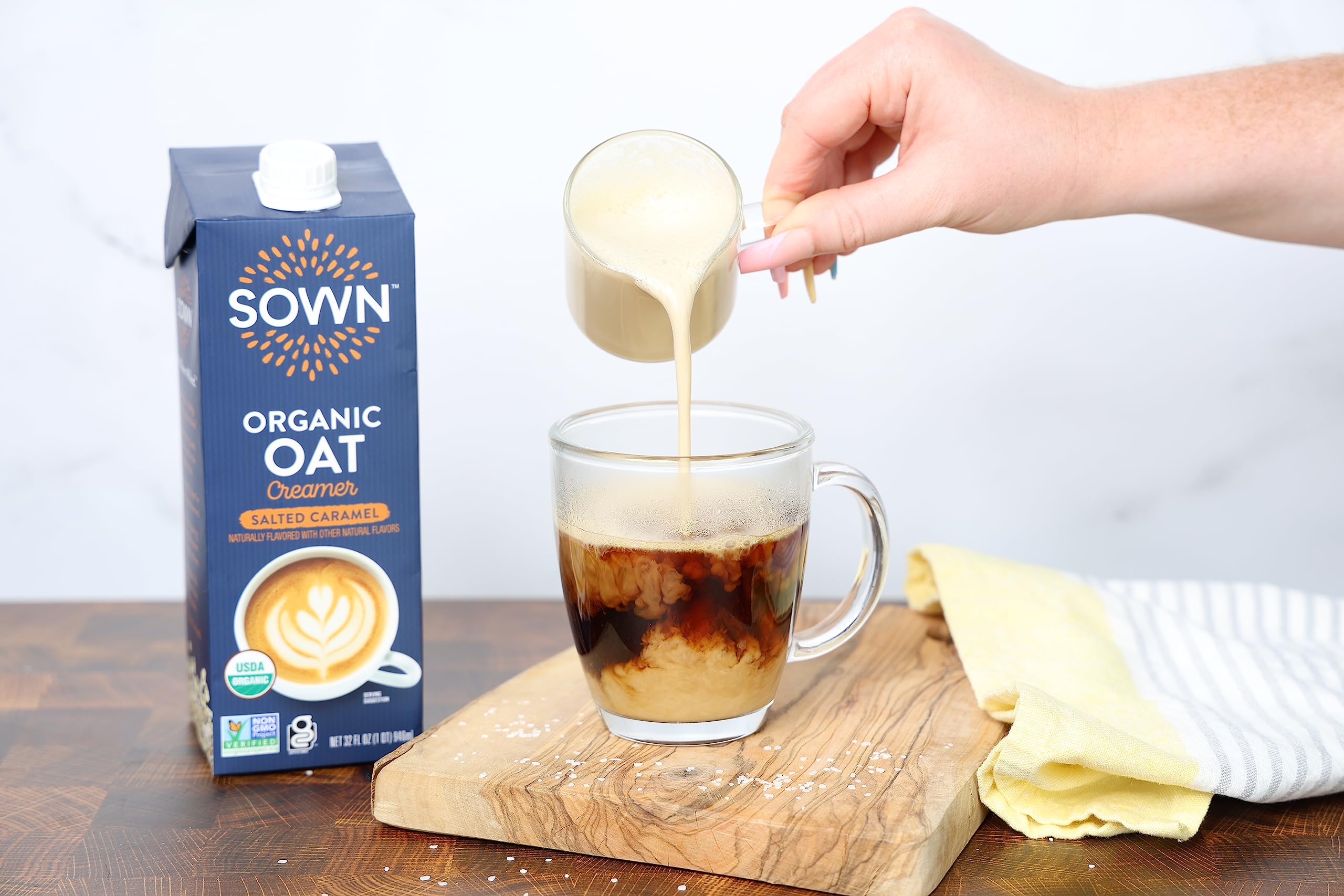 SOWN creamer poured into coffee cup creating creamy salted-caramel flavor