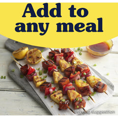 Seared SPAM Teriyaki slices on a pan highlighting crisp edges and savory appeal
