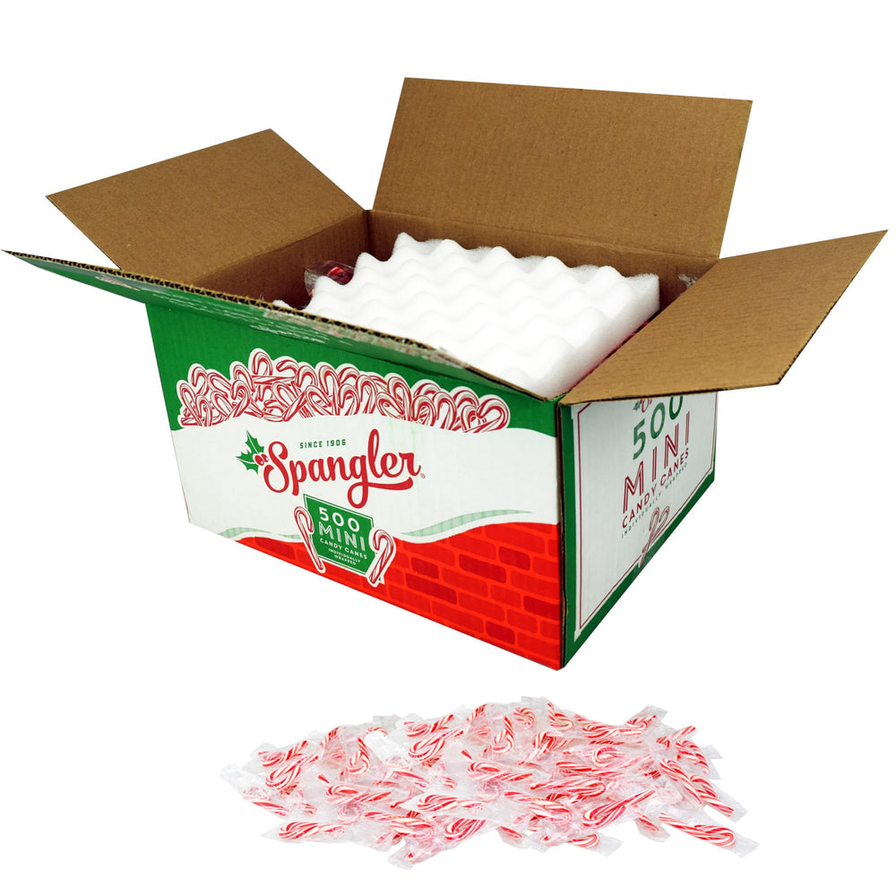 Spangler mini candy cane stirring hot cocoa adding peppermint flavor and festive look