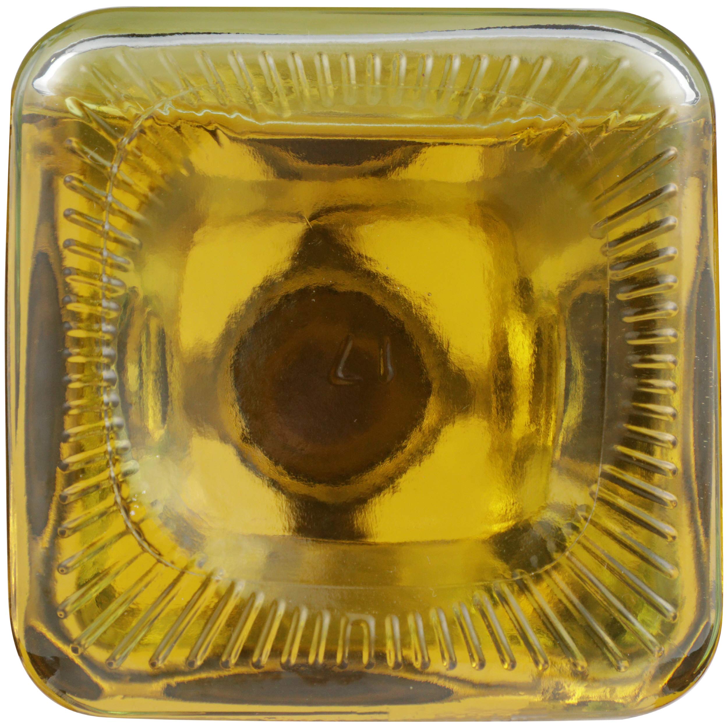 Spectrum bottle next to a standard spice jar showing compact size