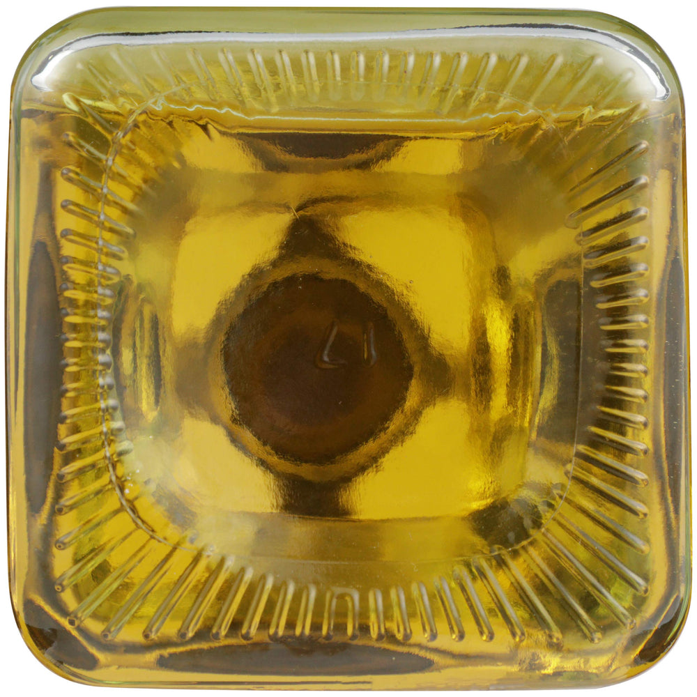 Spectrum bottle next to a standard spice jar showing compact size