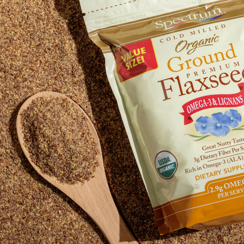 Spectrum opened pouch revealing ground flaxseed texture and freshness benefit