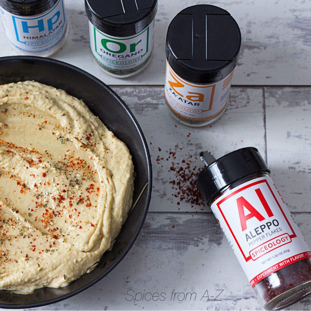 Spiceology Aleppo jar next to common objects to show 14 oz scale and pantry fit