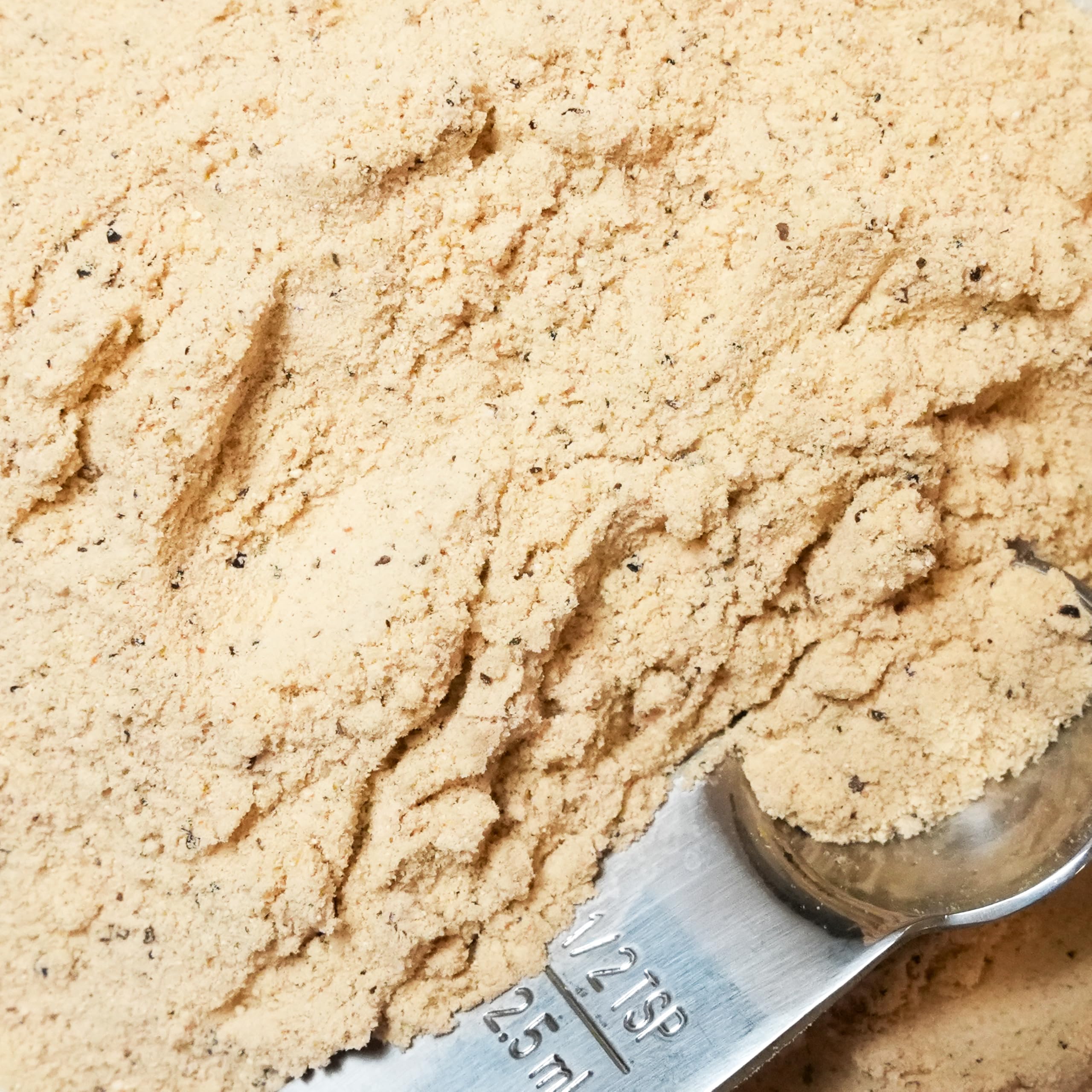 Spiceology seasoning dusted on pasta, creating instant creamy, nutty flavor