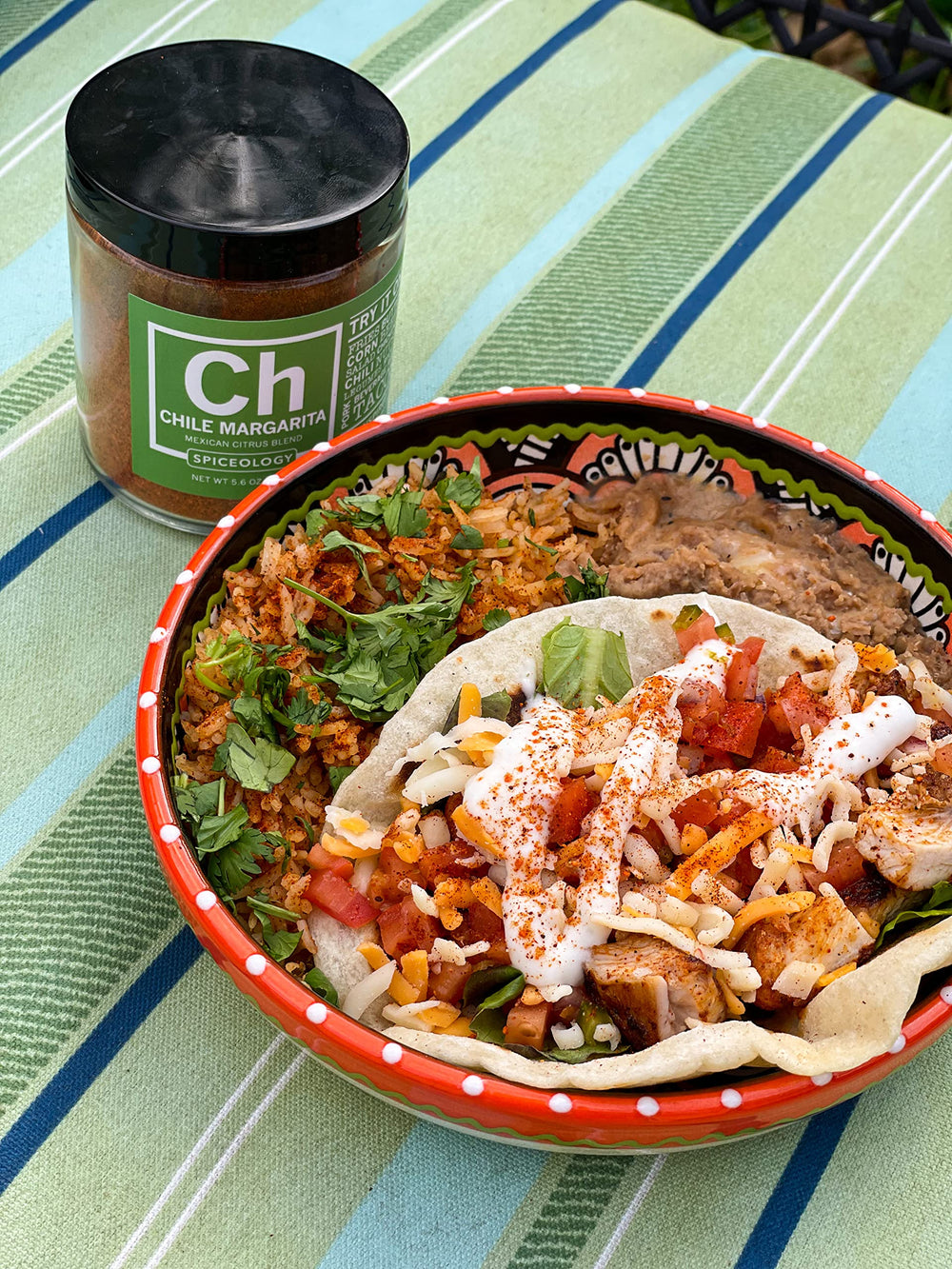 Outdoor grill scene with Spiceology Chile Margarita jar used by home cook