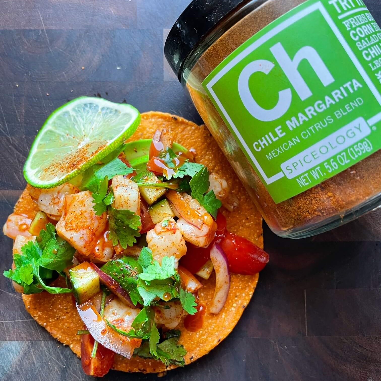 5.6 oz Spiceology Chile Margarita jar beside measuring spoon for portion reference