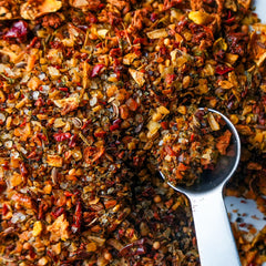 Spiceology Derek Wolf spoon with rub beside label showing ingredient clarity