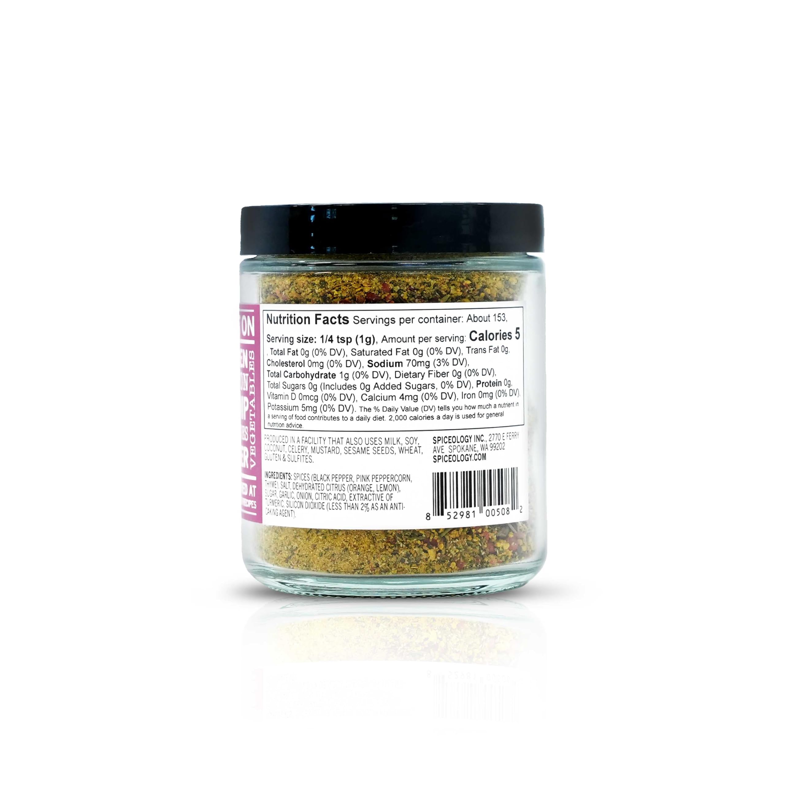 Close-up of lemon peel, pink peppercorns, and thyme pieces — Spiceology fresh ingredients visible