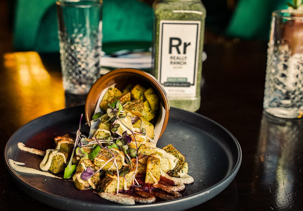 Spiceology sprinkled on roasted vegetables showing added ranch flavor without salt