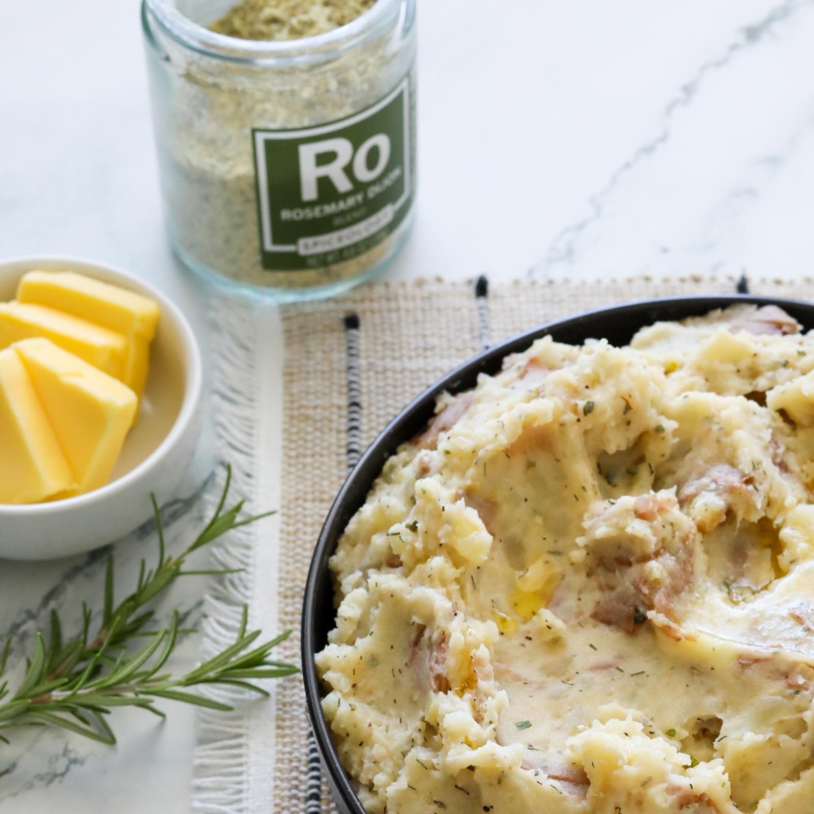 Freshly baked bread brushed with Spiceology rosemary Dijon for savory crust