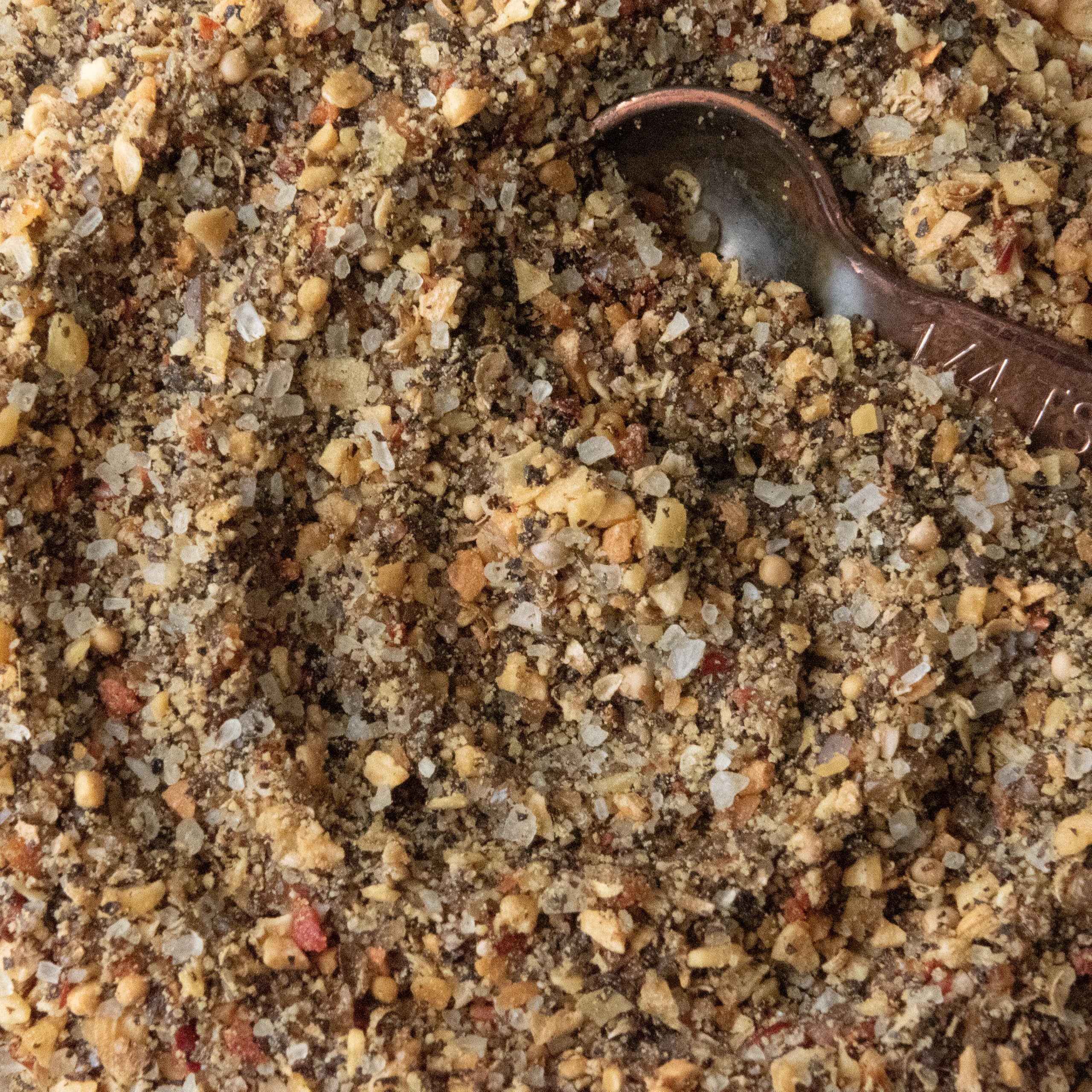 Spiceology seasoning sprinkled on roasted vegetables, adds smoky complexity and color