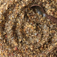 Spiceology seasoning sprinkled on roasted vegetables, adds smoky complexity and color