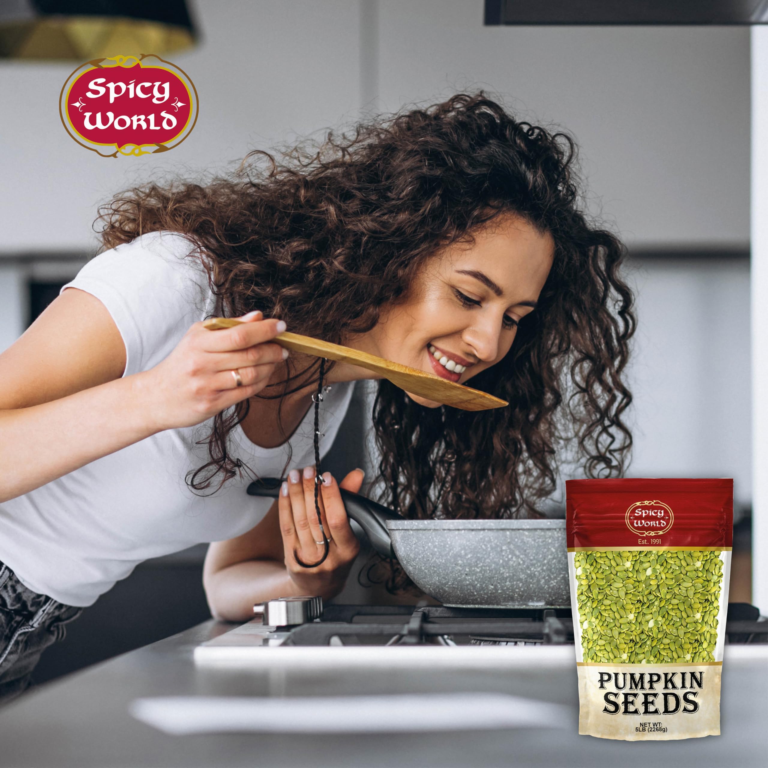 Spicy World hand holding seeds for scale to show bulk quantity and portion sizing