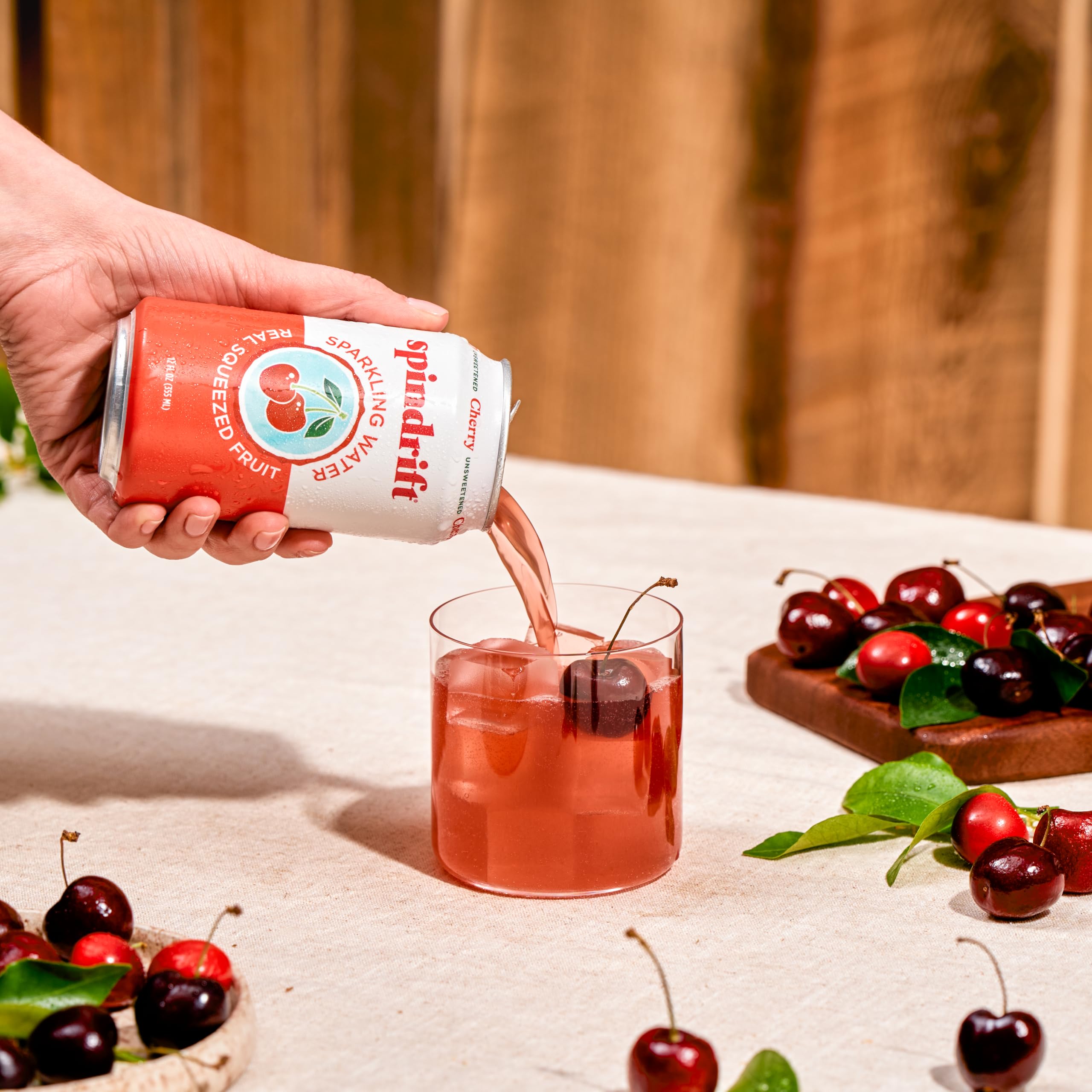 Stacked 24-pack of Spindrift cherry cans illustrating bulk supply and entertaining convenience
