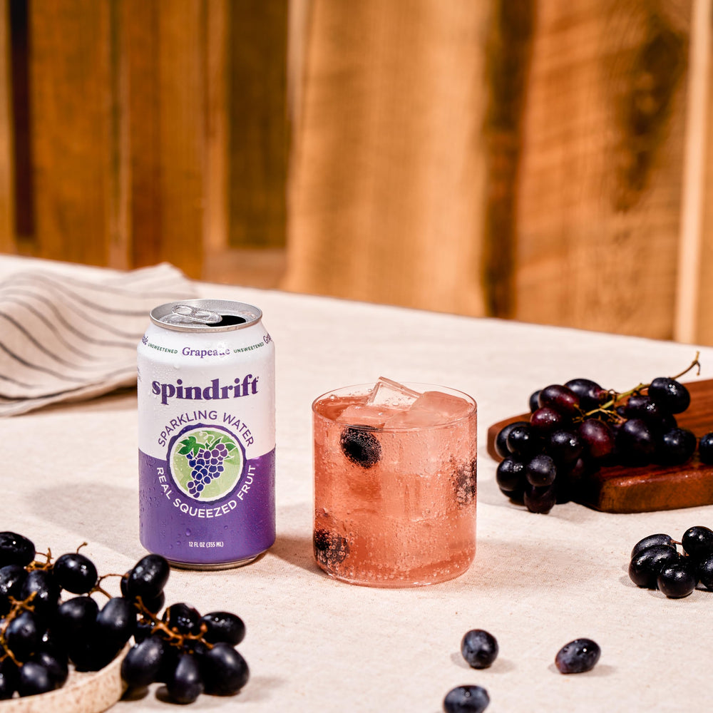 Spindrift cans at a picnic table showing outdoor serving and social enjoyment
