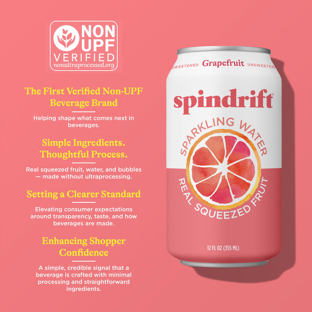 Spindrift grapefruit can beside sliced grapefruit illustrating real squeezed fruit content