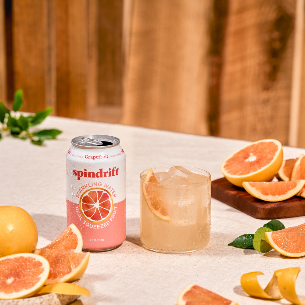 Spindrift grapefruit can held in hand for scale and convenient single-serve benefit