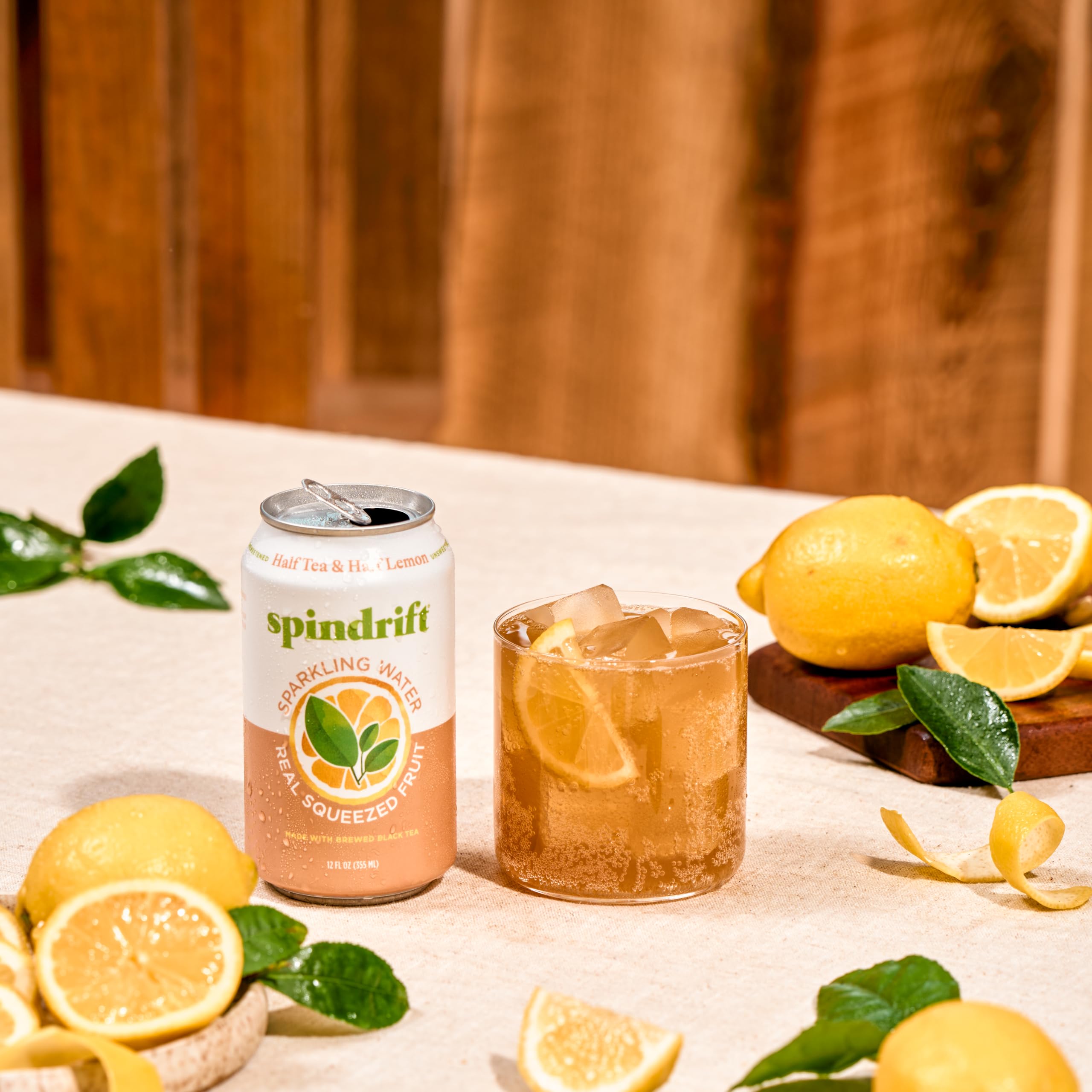 Fresh lemons next to Spindrift can highlighting real squeezed fruit sourcing