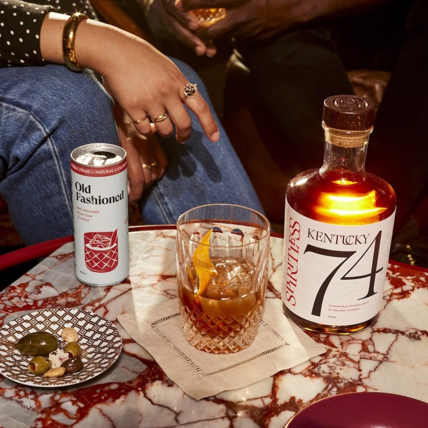 Spiritless cans at a backyard gathering showing social, alcohol-free enjoyment