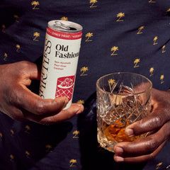 Spiritless can being poured over ice demonstrating easy serving and ritual
