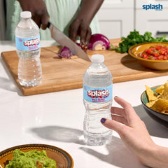 SPLASH REFRESHER bottle held in hand, single-serve portability benefit