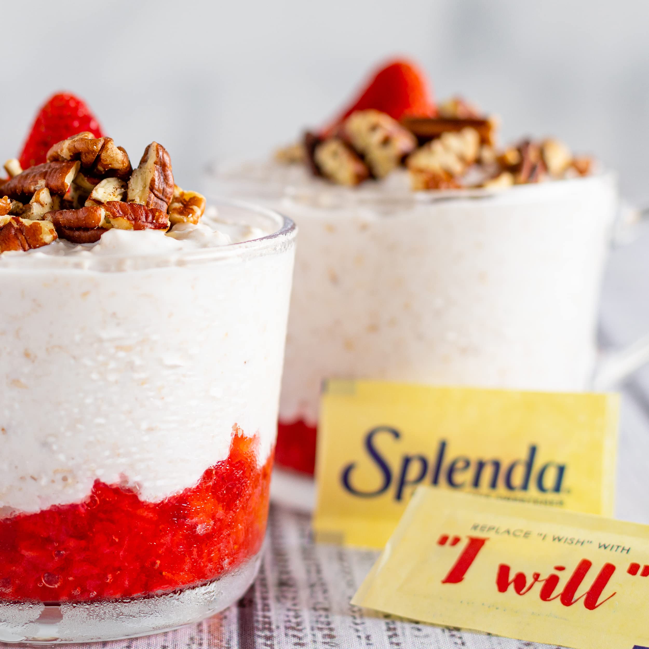SPLENDA opened packet revealing premeasured contents, easy single-serve benefit